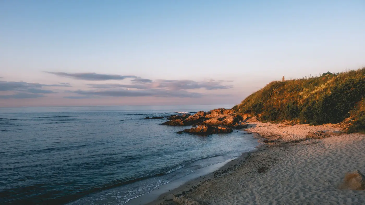 Peaceful sunrise over Sandy Beach in Sozopol, Bulgaria with serene sea views.