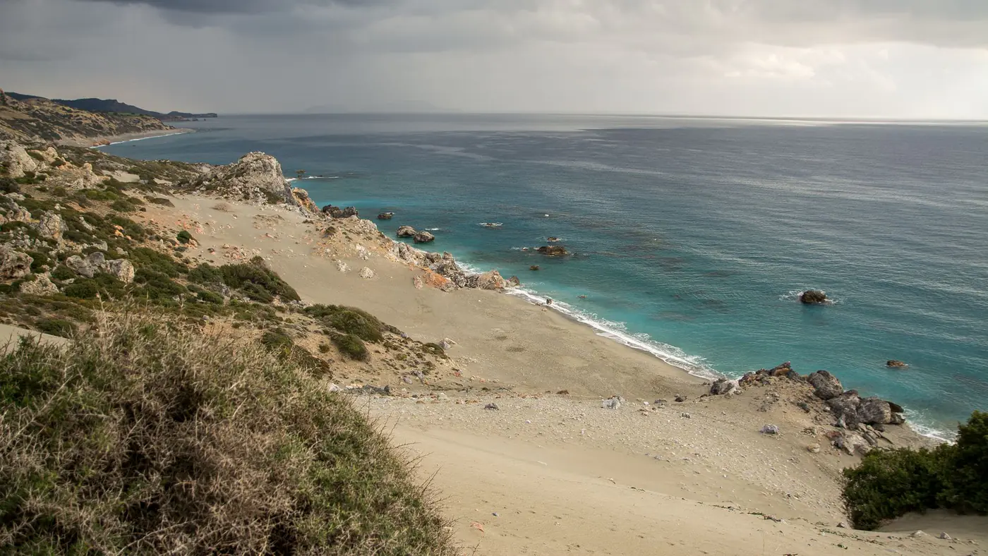 Explore a dramatic seascape with rugged coastline and cloudy skies, ideal for nature and travel themes.