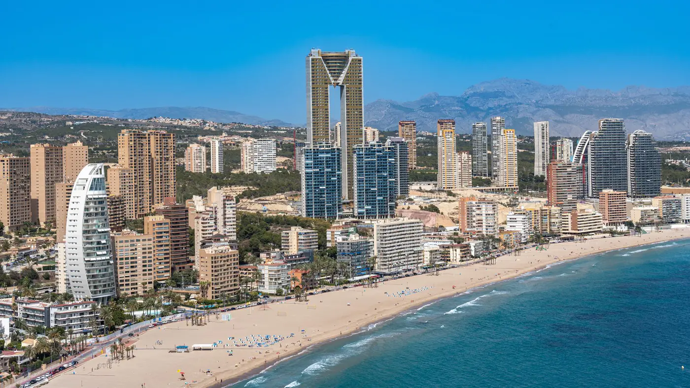 Aerial view of Benidorm's beachfront with iconic Intempo building.