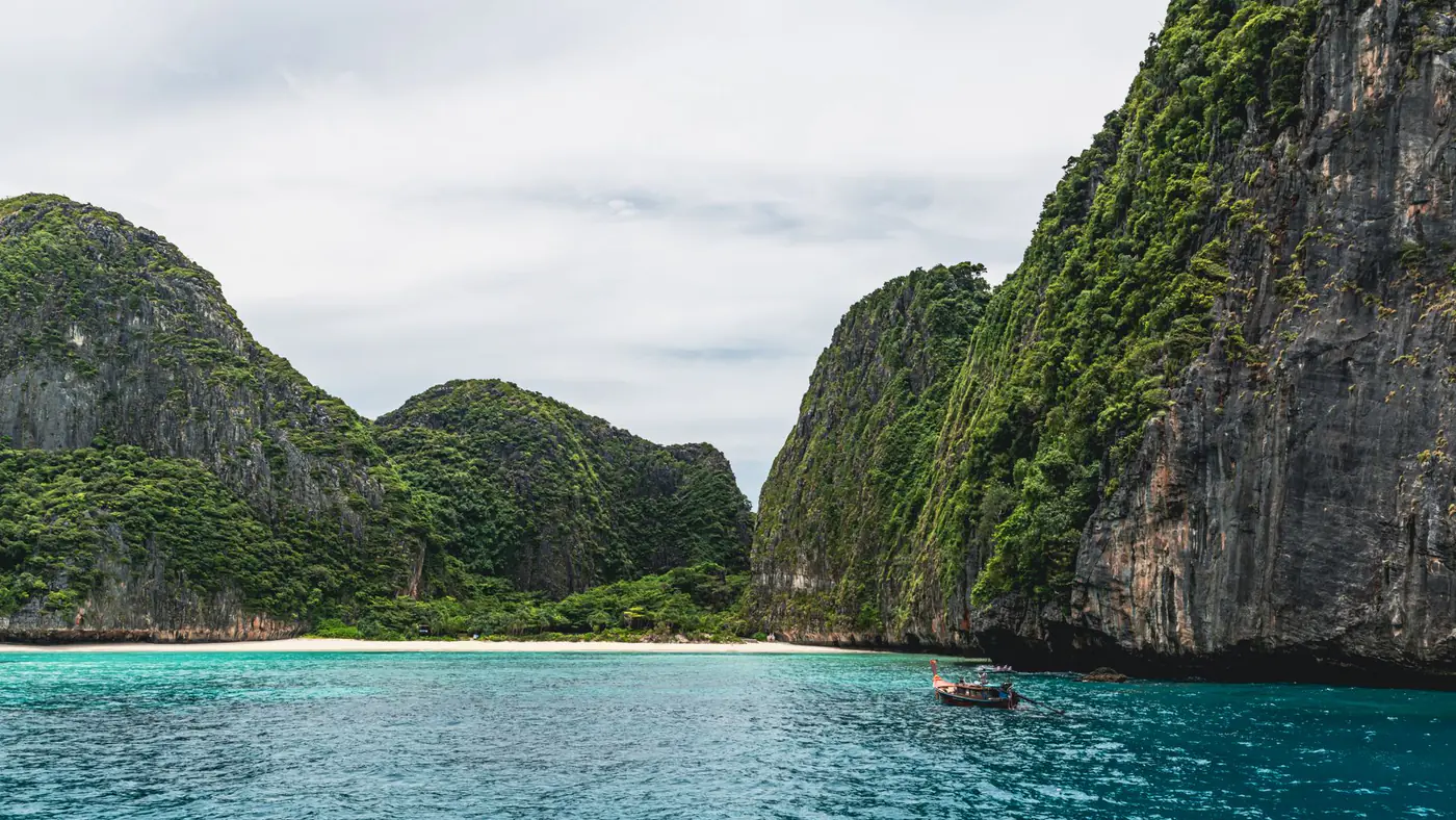 Beautiful coastal view of limestone cliffs and turquoise waters in Phuket, Thailand, perfect for travel inspiration.