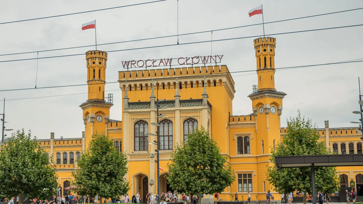 Vibrant facade of Wrocław Główny train station, a key landmark in Wrocław, Poland.