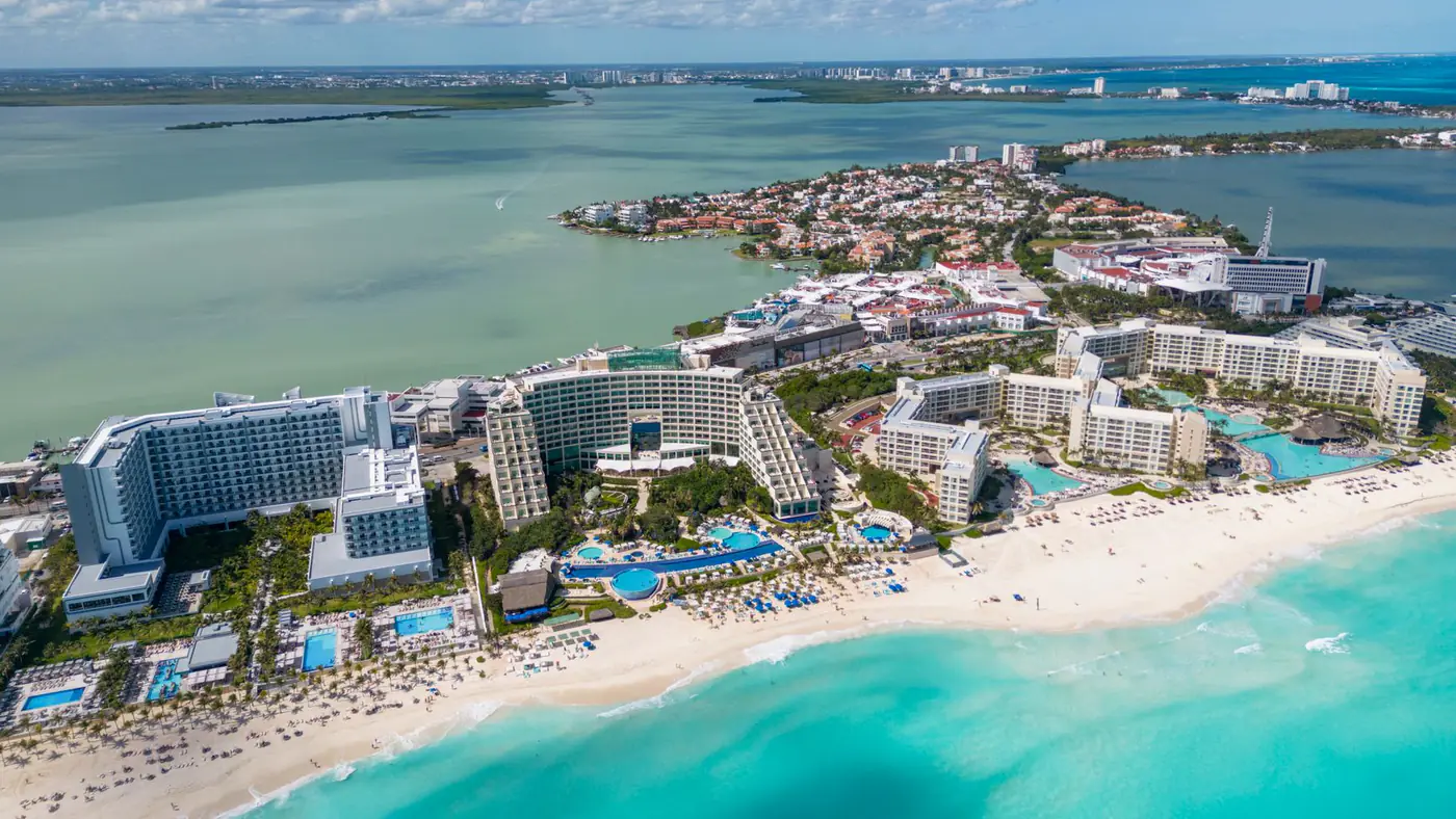 A stunning aerial view of Cancun's resorts and turquoise sea, ideal for vacation and travel scenes.