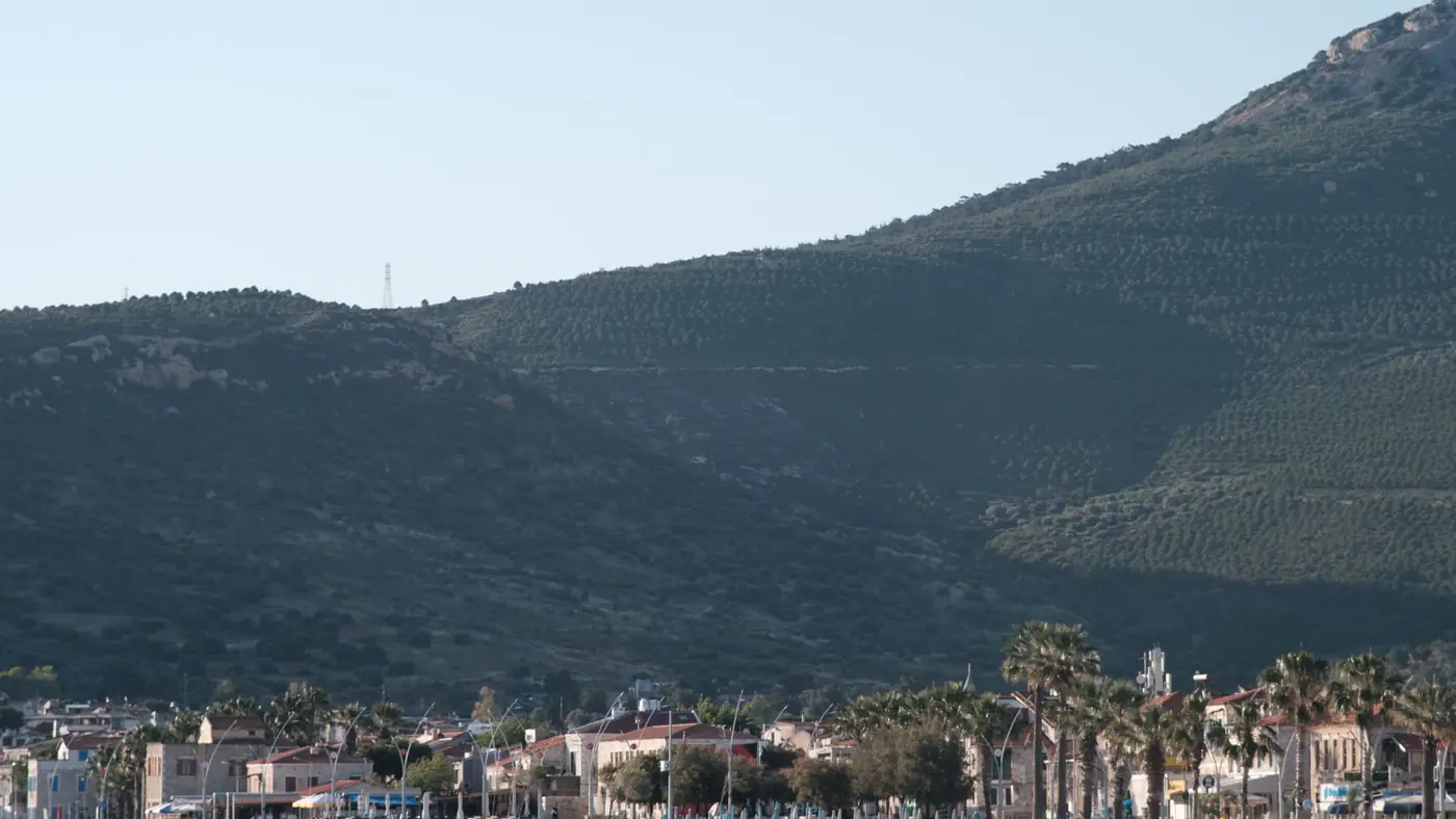 Beautiful summer view of Foça, İzmir with mountains and coastal town.